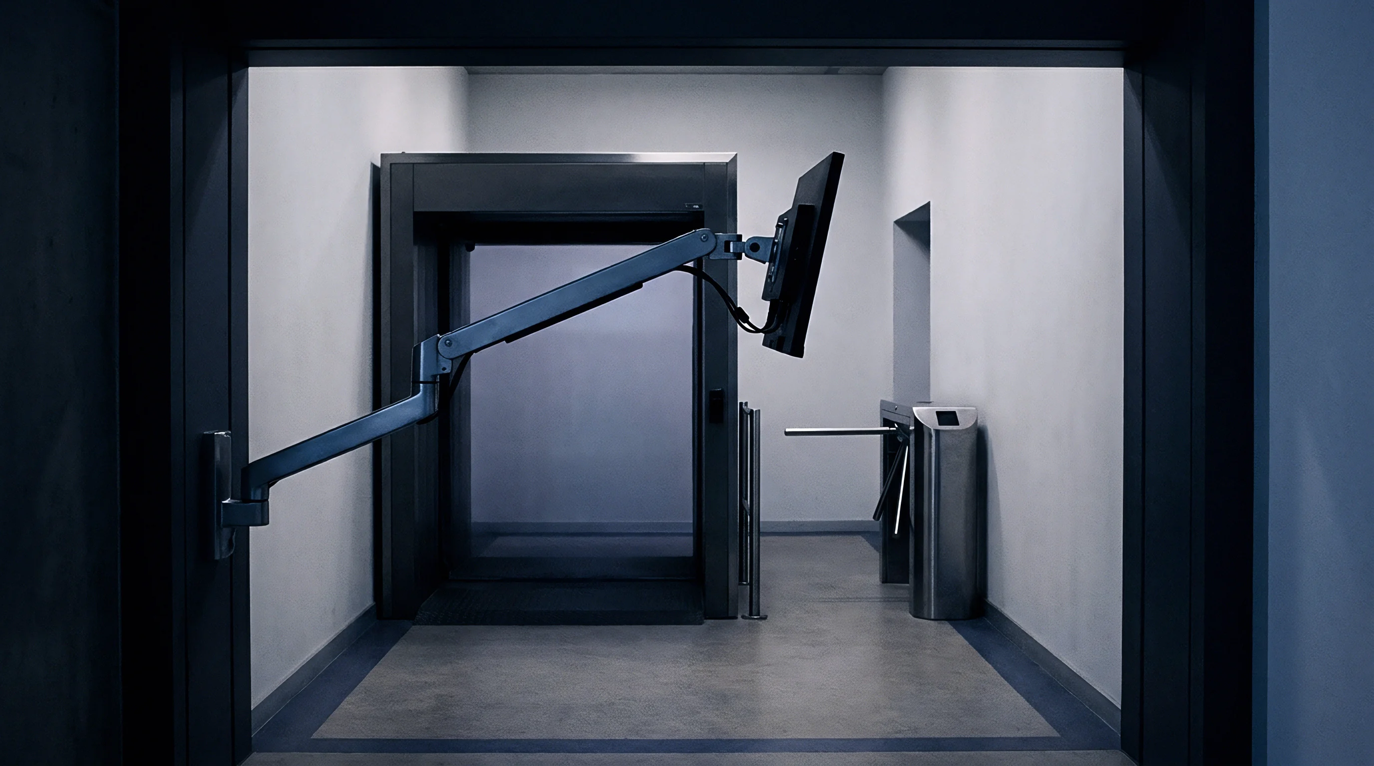 A metal screening portal and electronic turnstile occupy a concrete industrial corridor equipped with an adjustable display mount.